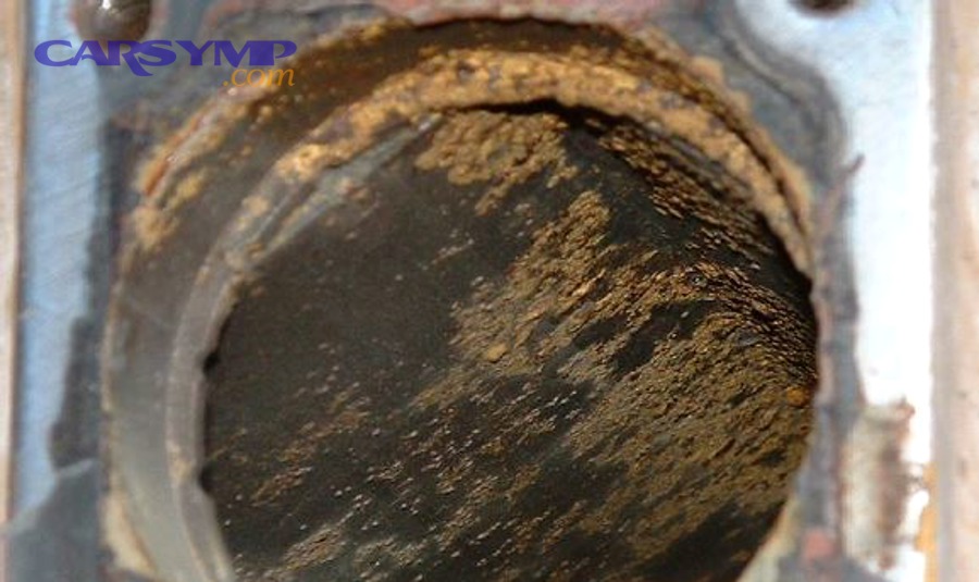 rusted car radiator showing external corrosion on metal components and tanks