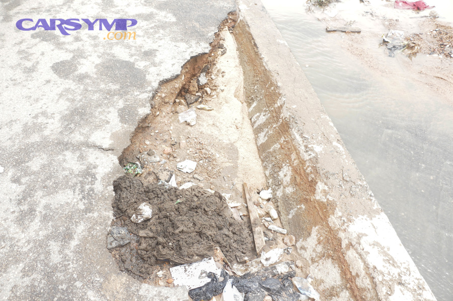 Large road pothole that can damage tires and wheels