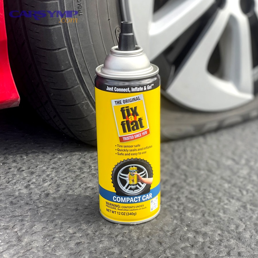 Tire tread puncture being repaired using a plug kit tool