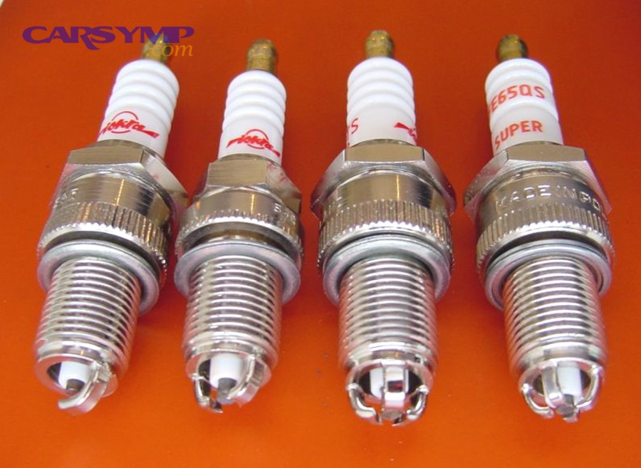 Spark plug close-up showing electrode and threads