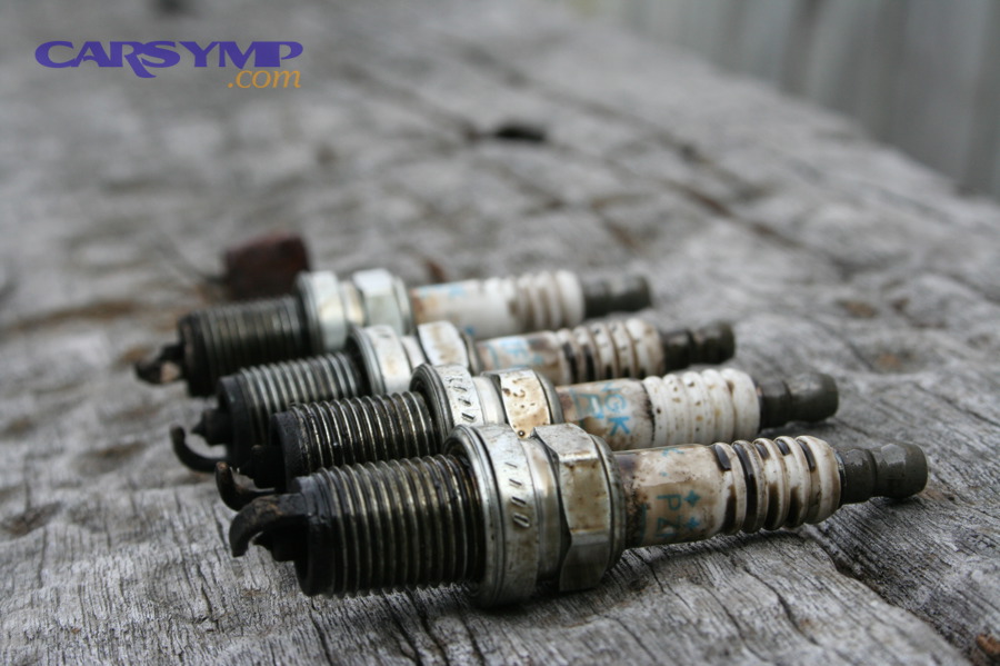 Spark plugs showing wear and deposits