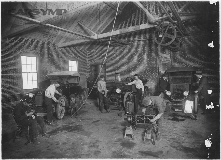 Auto repair shop work environment with students or technicians