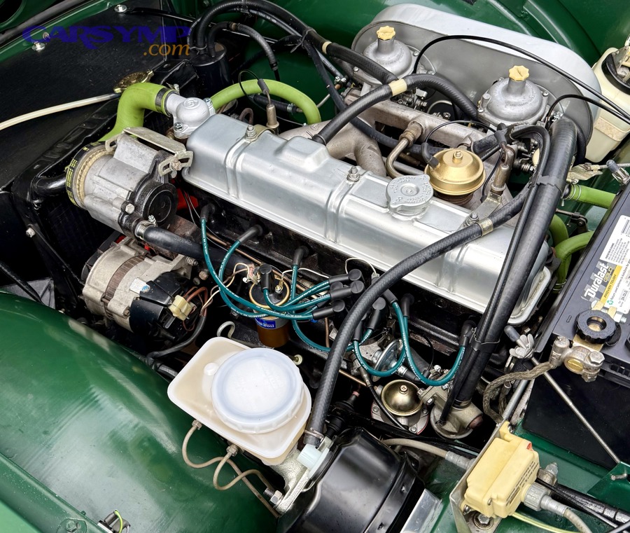 Engine bay showing emissions control components including charcoal canister