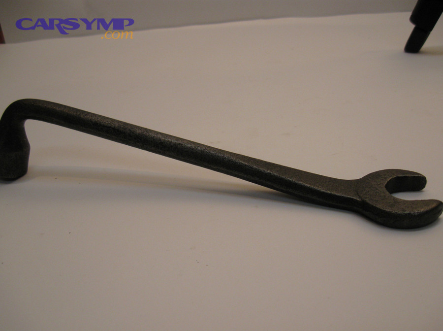Tire iron used to loosen and tighten lug nuts