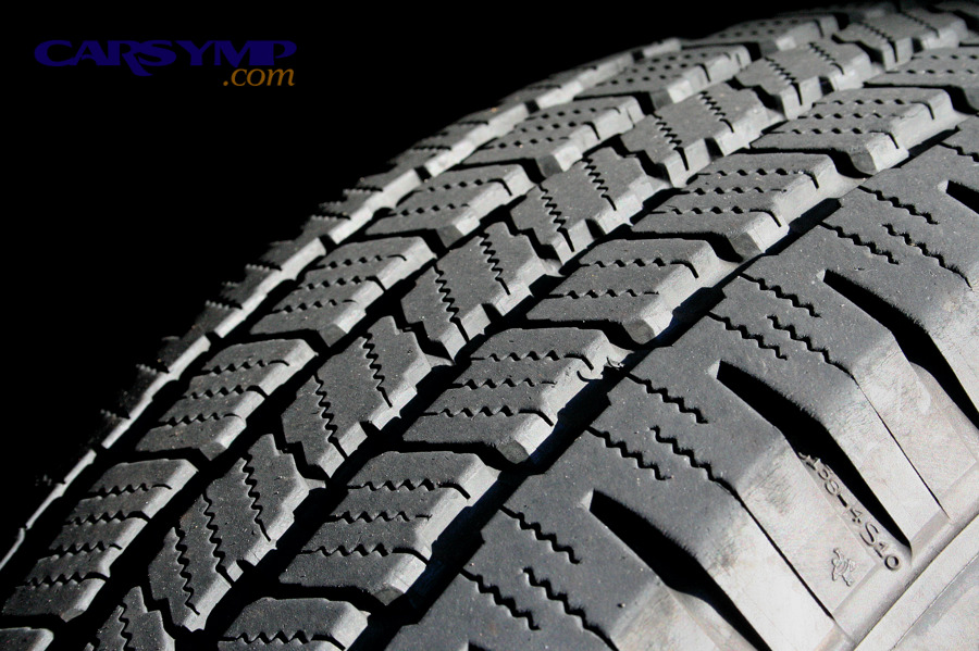 Tire tread close-up where soapy water can reveal puncture leaks