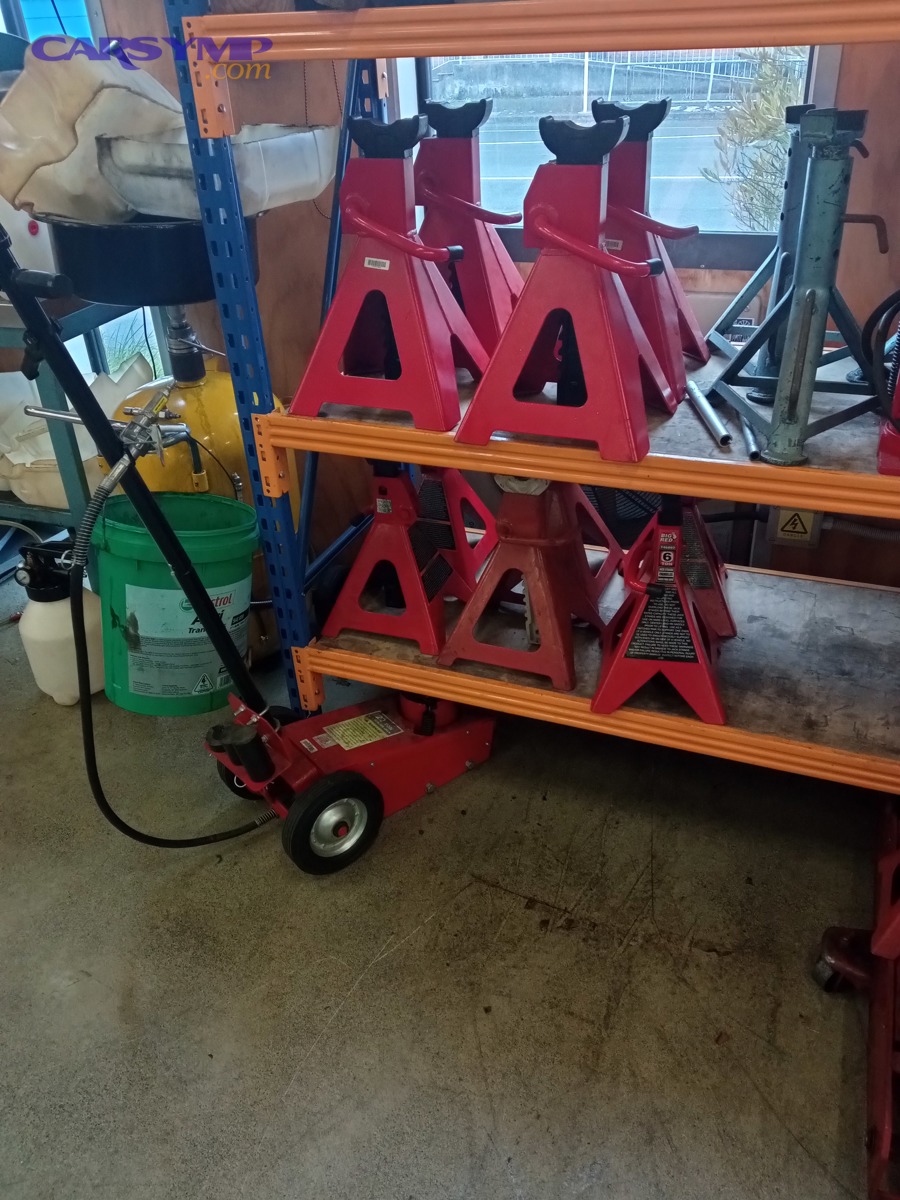 Trolley jack and axle stands for safely supporting a vehicle during DIY repairs