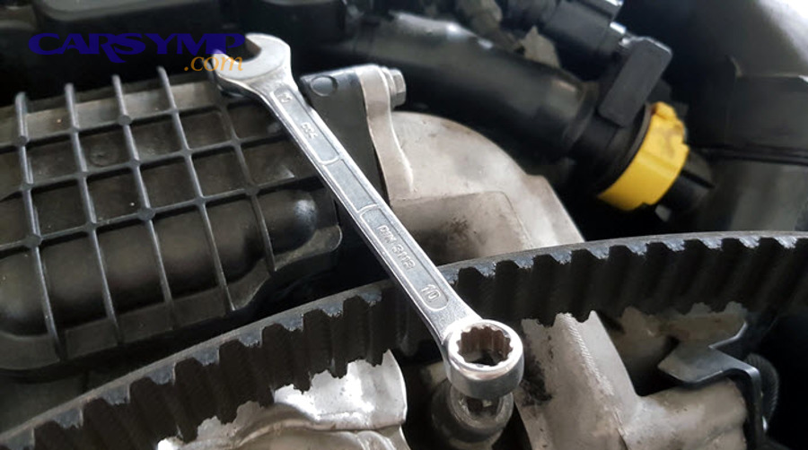 corroded belt tensioner showing rust and wear damage requiring replacement