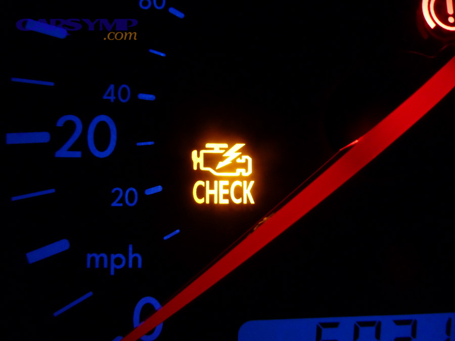 Engine warning light illuminated on a dashboard
