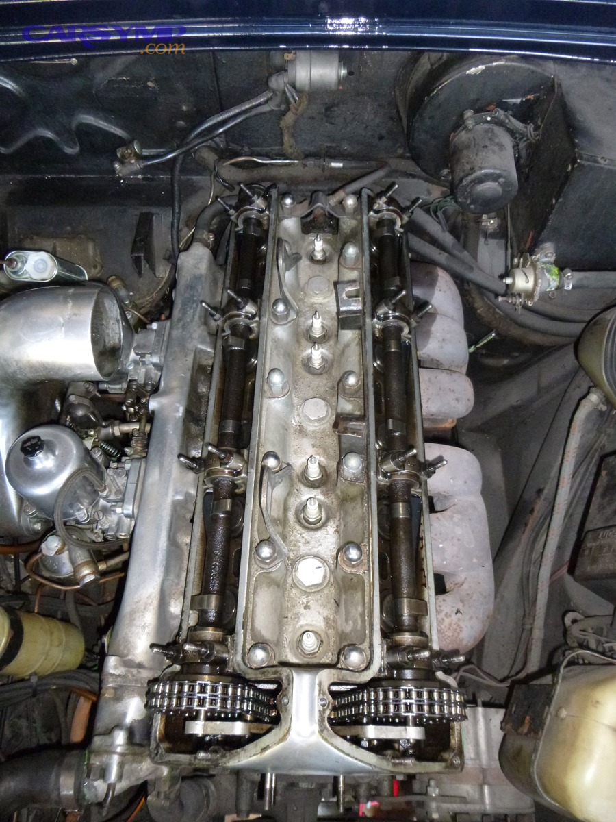 Cylinder head with cam covers removed showing camshaft area and fasteners