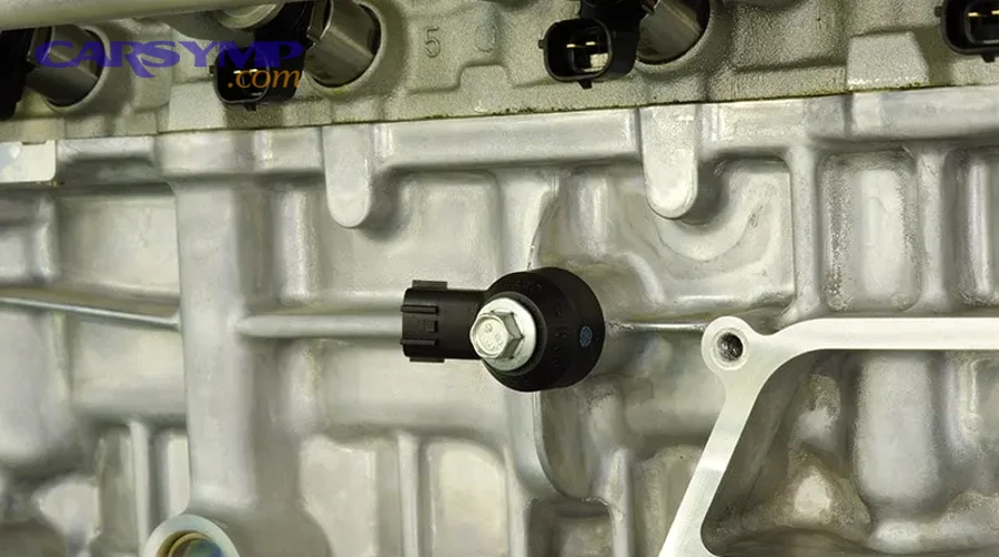 Close-up photo of tie rod end and ball joint near brake rotor