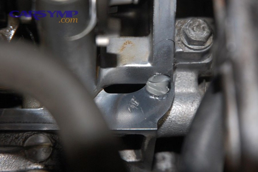 Applying a small dab of RTV at a corner joint area before installing a valve cover gasket