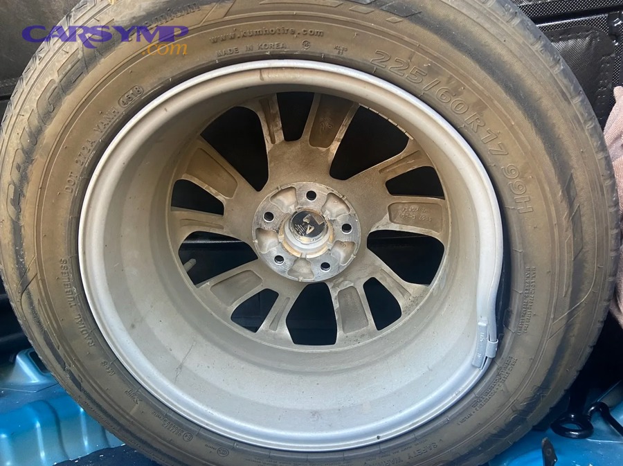 before and after comparison of bent rim repair showing straightened wheel