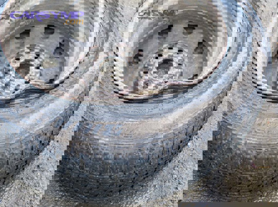 illustration showing common causes of bent rims including potholes curbs and impacts