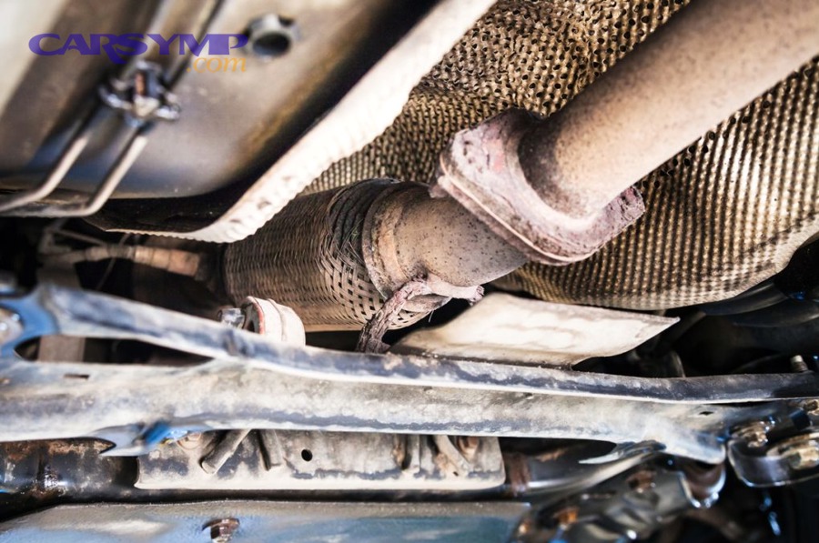 Automotive AC evaporator where condensation forms and drains outside