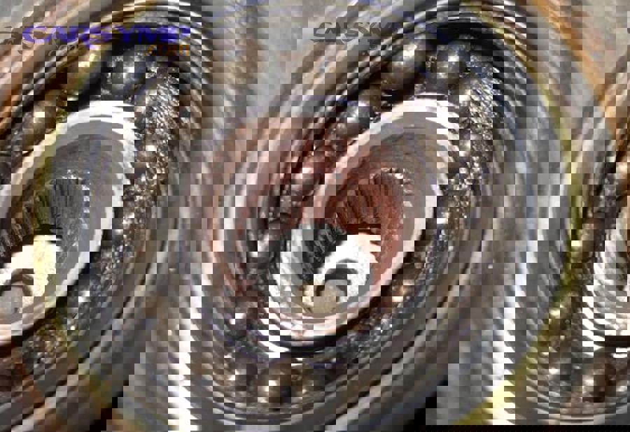 Tire with visible cupping/scalloped wear that can cause humming