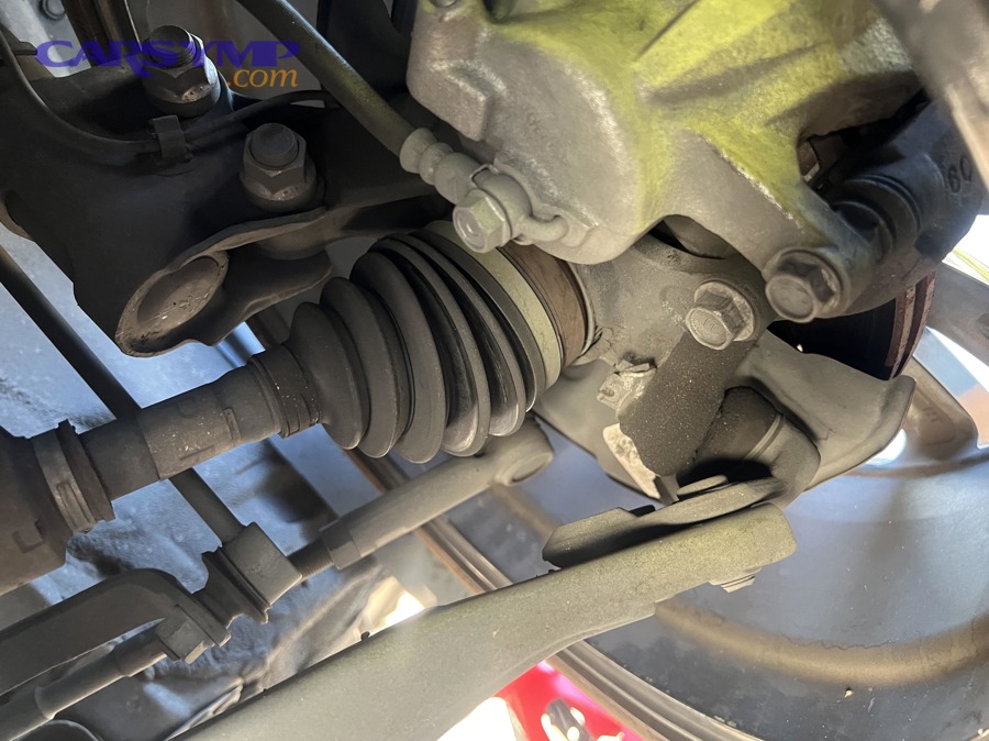 Failed ball joint example showing abnormal wheel angle and control arm area
