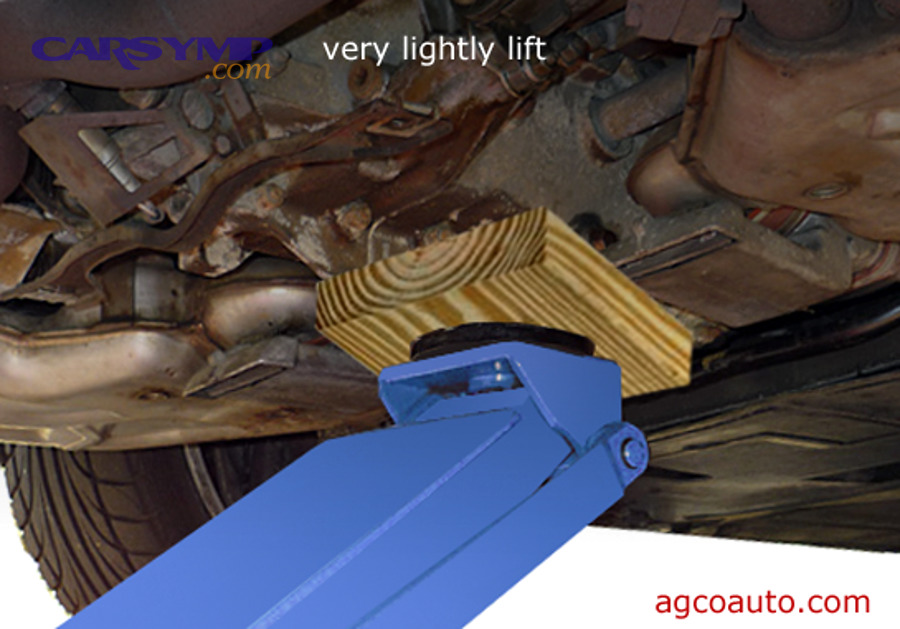 Engine mount check using a jack and a wood block to lightly support the engine