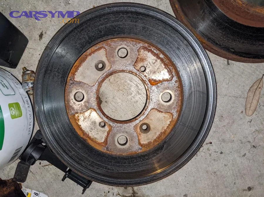 Close-up of a disc brake caliper and rotor assembly