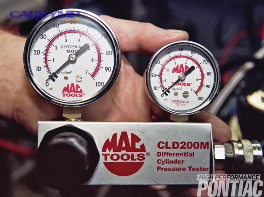 Mechanic evaluating engine diagnostics results