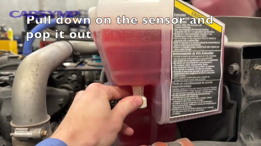 What symptoms indicate a stuck float or faulty coolant level sensor?