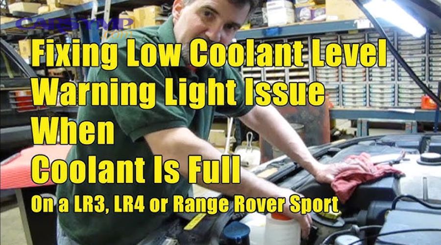 Is it safe to drive with a low coolant warning if the reservoir looks full?