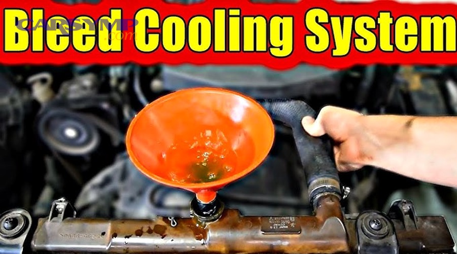 Temperature gauge on car dashboard showing normal operating range during coolant system bleeding verification