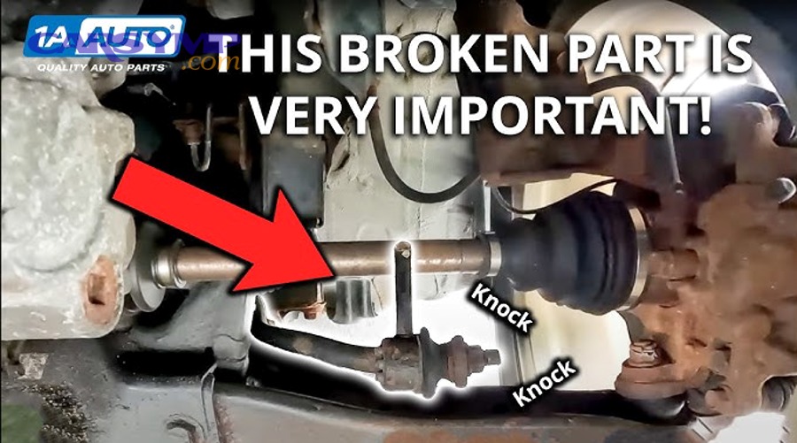 Mechanic inspecting car suspension components with vehicle safely lifted on jack stands