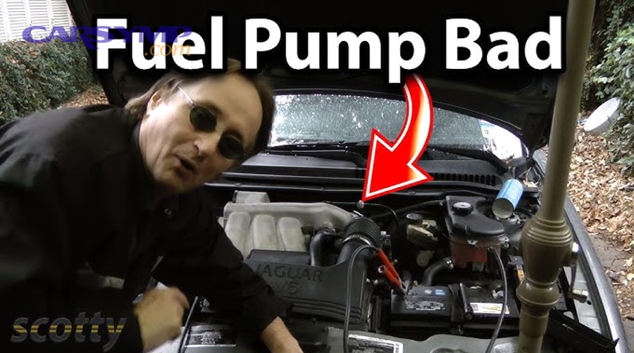 Mechanic performing diagnostic work on a vehicle engine and fuel delivery system