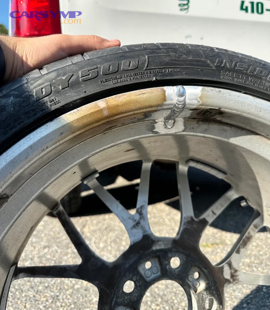 Cold-spray aluminum repair equipment showing supersonic nozzle depositing metal particles onto wheel surface with minimal heat generation