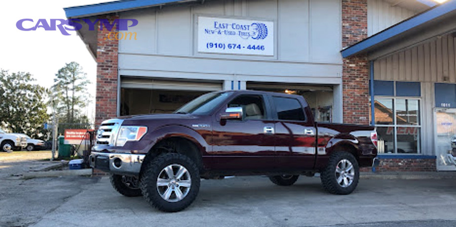Tow truck towing a vehicle on the road