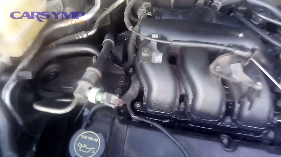 Engine bay view near intake manifold area during diagnosis