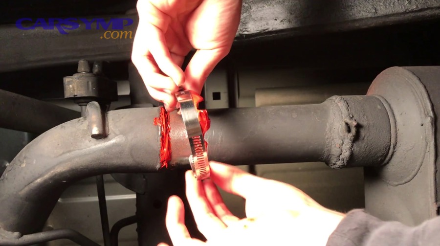 Car supported safely on jack stands for underbody inspection