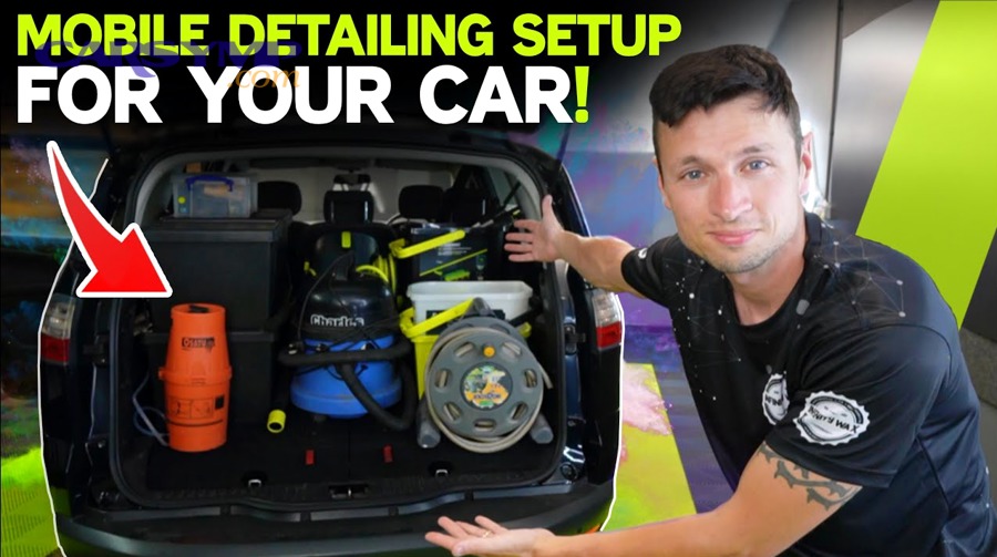 Car being lifted with a floor jack on a driveway surface