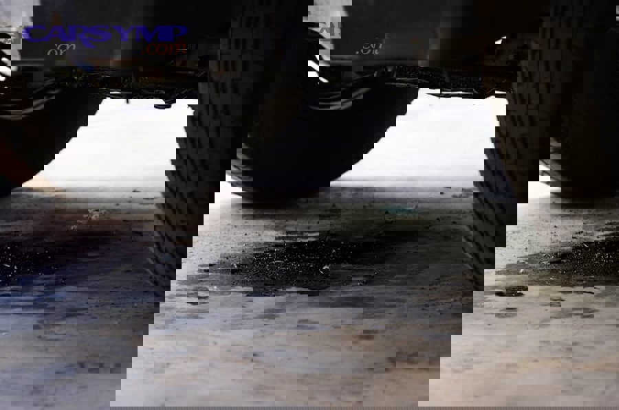 Engine oil dipstick used to confirm fluid level when diagnosing leaks