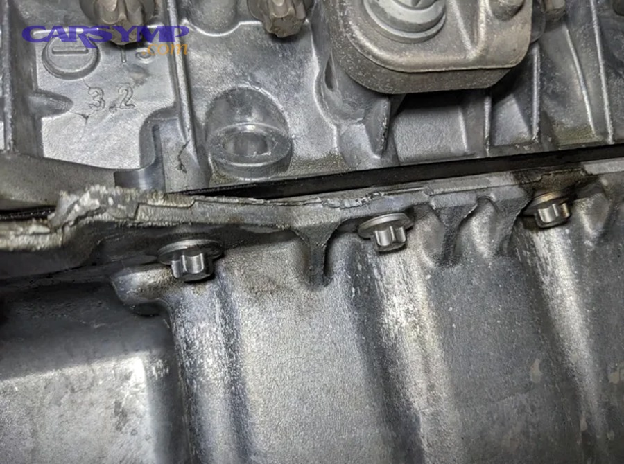 Diagram of oil pan gasket and sealant locations along engine sealing points