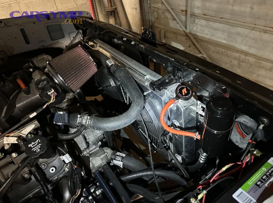 Radiator pressure cap close-up showing seal and spring
