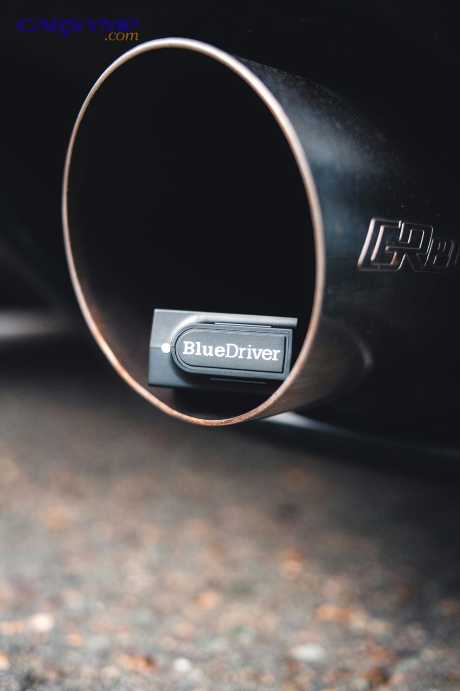 Visible vapor or smoke coming from a car exhaust tailpipe