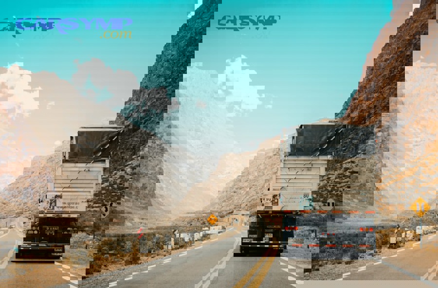 tow truck helping stranded vehicle on roadside