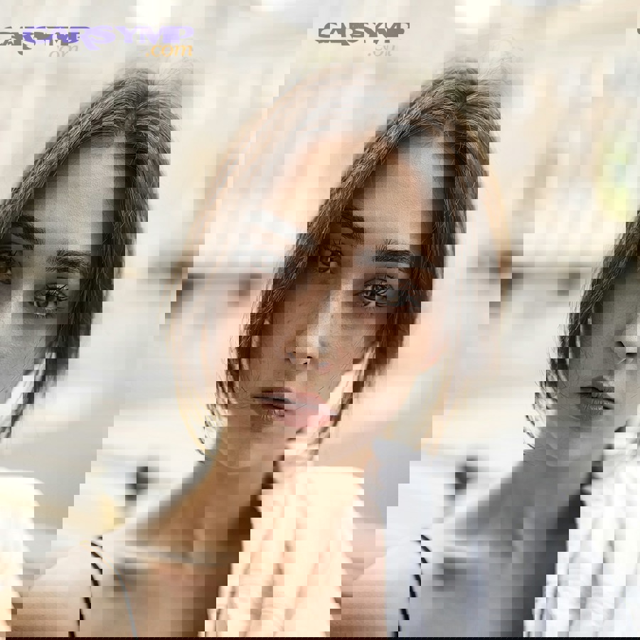 Close-up of shredded cheese spread on white plate under bright lighting for inspection