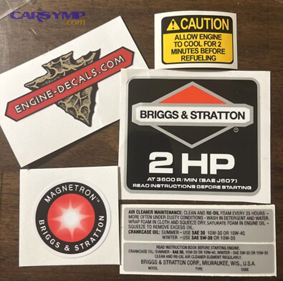 Dipstick showing low and full oil level marks for monitoring consumption