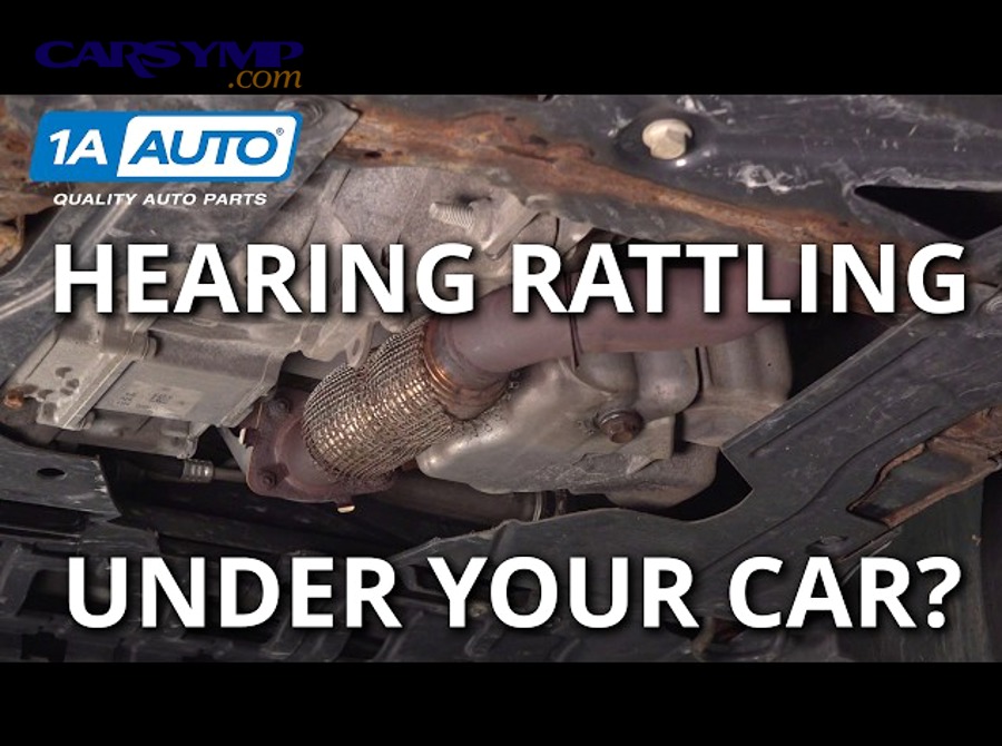 mechanic removing debris stuck under car in wheel well area