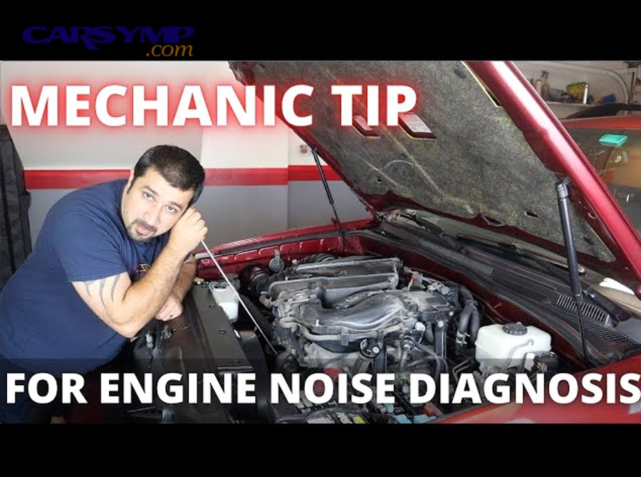 mechanic inspecting car door panel cavity with flashlight