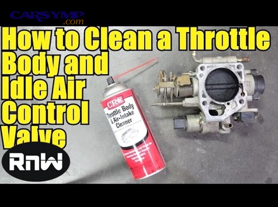 Throttle body exposed after removing air intake tube showing carbon deposits on throttle plate