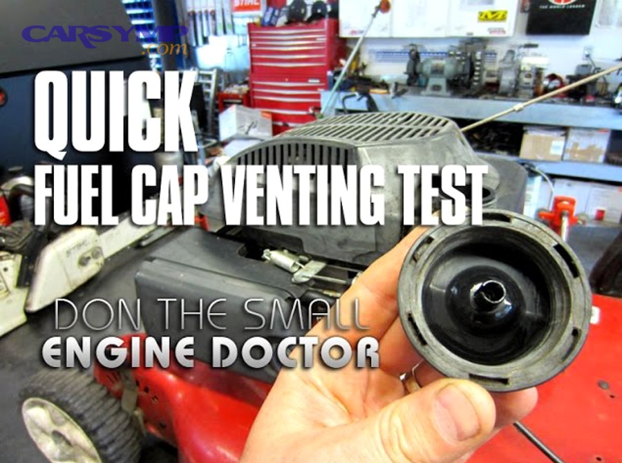 Automobile fuel filler cap open showing the cap and filler neck area
