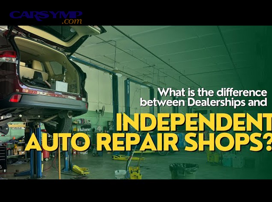 Technicians inspecting a car in a dealership service bay