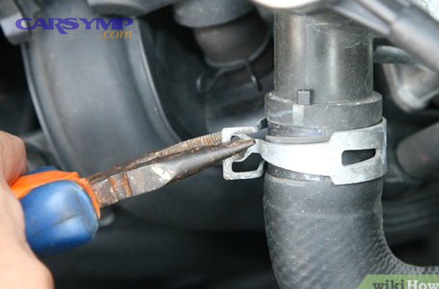 Upper radiator hose example in an engine bay (cooling system hose routing)