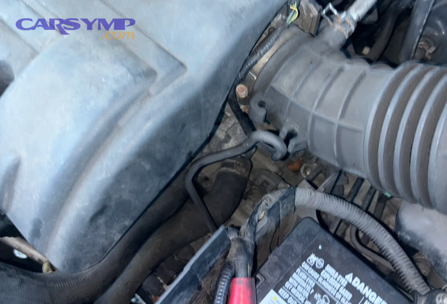 Car engine compartment where vacuum hoses and intake connections are located