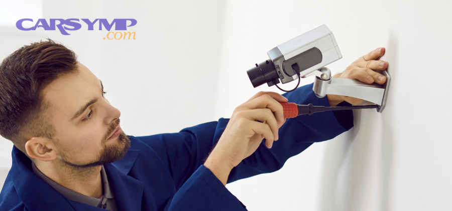 Mechanic holding a spark plug during a tune-up inspection