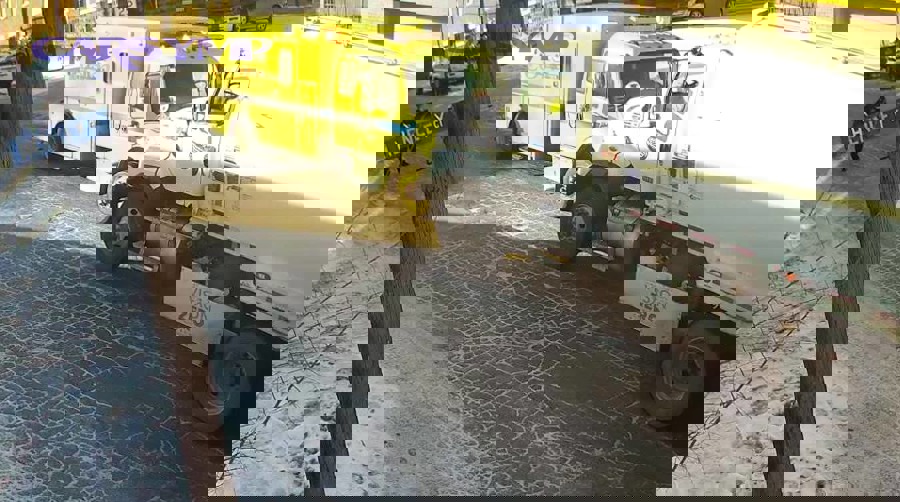 Close-up of tire tread pattern showing tread blocks that generate noise on road surfaces