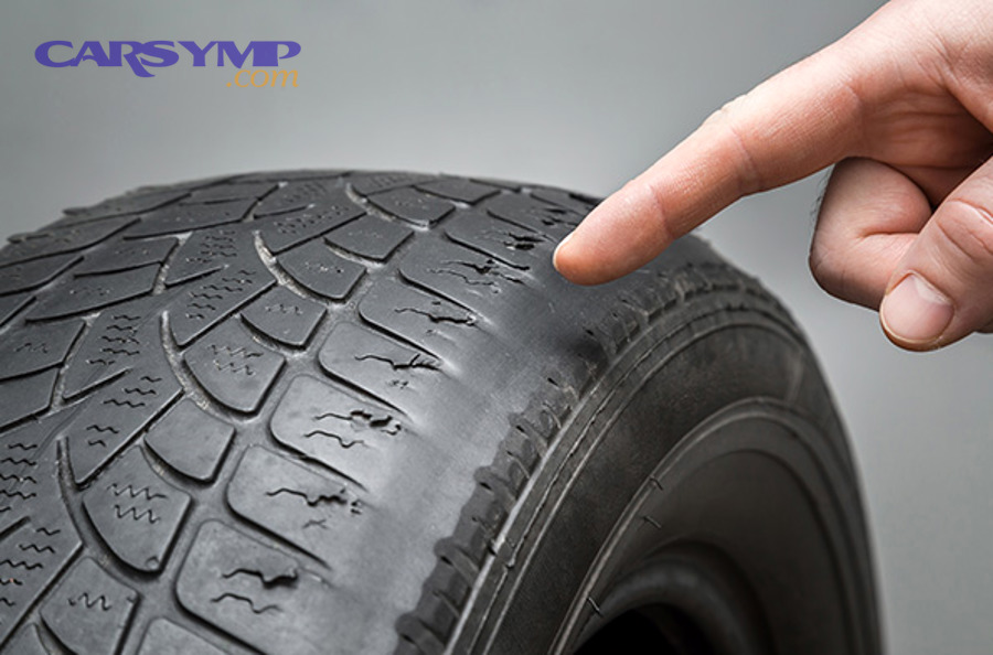 Vehicle wheel and tire used to explain uneven tire wear patterns